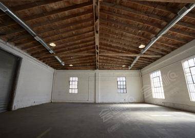 Downtown Brick Warehouse with Bowed Wooden Beams